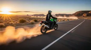 2025 Kawasaki KLE adventure motorcycle on a desert highway during sunset